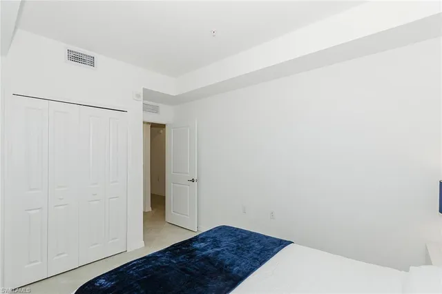 a view of hallway with bathroom