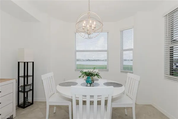 a view of a dining room with furniture and window