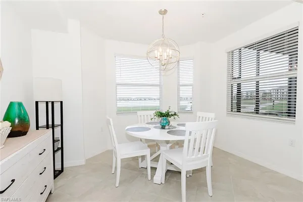 a view of a dining room with furniture window and outside view