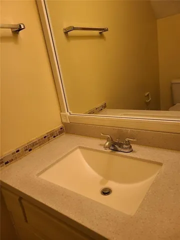 a bathroom with a tub and a sink