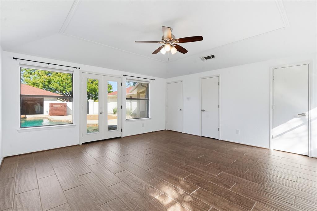 2201 Mistletoe Boulevard Fort Worth, TX 76110 - Photo 14 of 31 a view of an empty room with wooden floor and a window