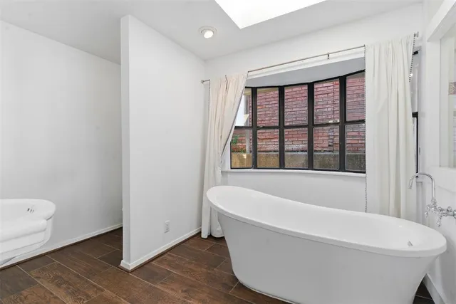 a white bath tub sitting in a bathroom