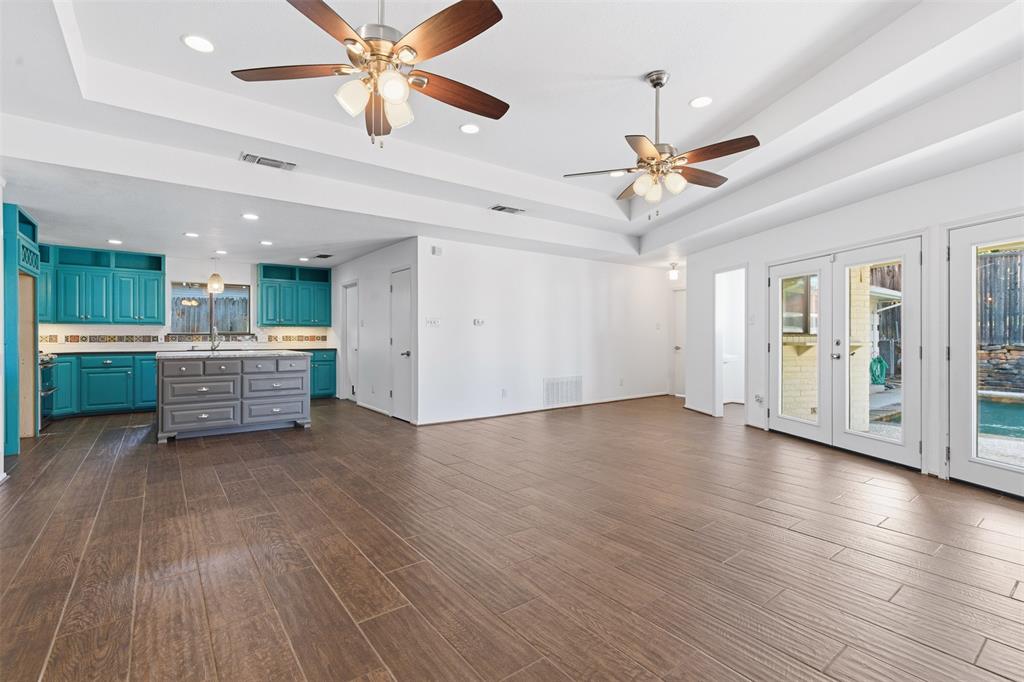 2201 Mistletoe Boulevard Fort Worth, TX 76110 - Photo 18 of 31 a view of an empty room with window and wooden floor