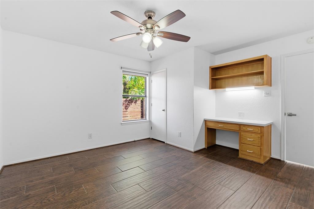 2201 Mistletoe Boulevard Fort Worth, TX 76110 - Photo 19 of 31 an empty room with windows and a fireplace