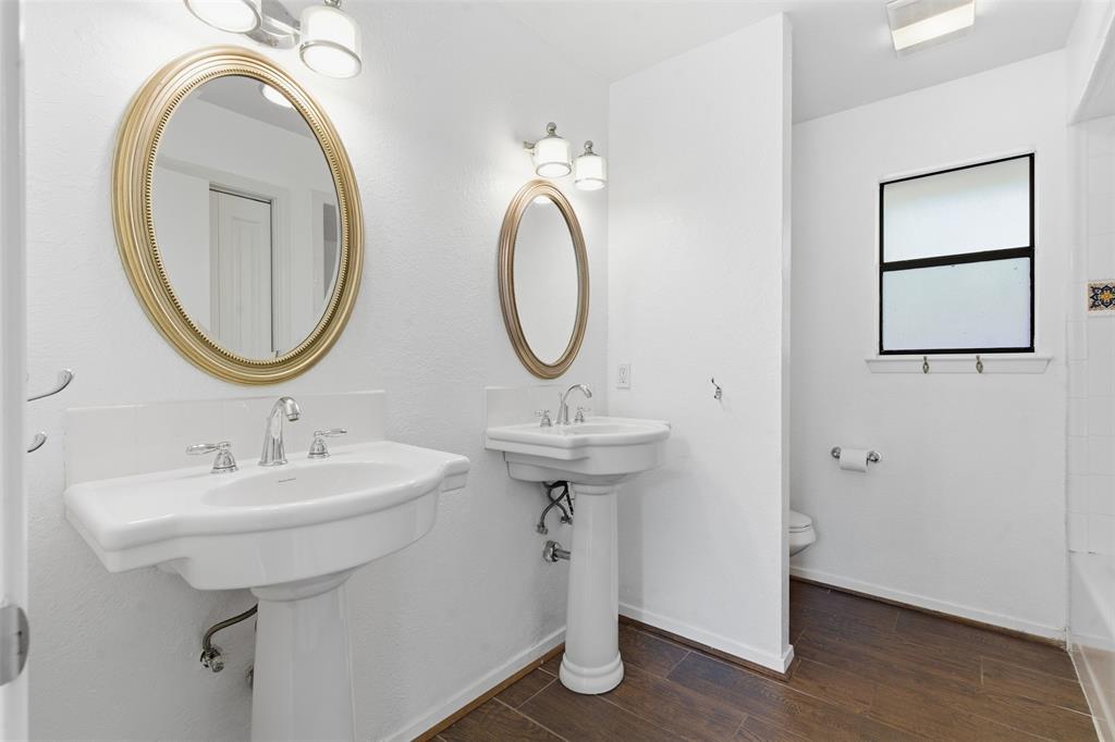 2201 Mistletoe Boulevard Fort Worth, TX 76110 - Photo 20 of 31 a bathroom with a sink and a mirror