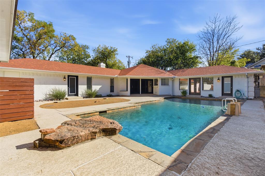 2201 Mistletoe Boulevard Fort Worth, TX 76110 - Photo 25 of 31 a view of a house with swimming pool and sitting area