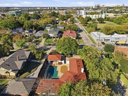 an aerial view of residential houses with outdoor space