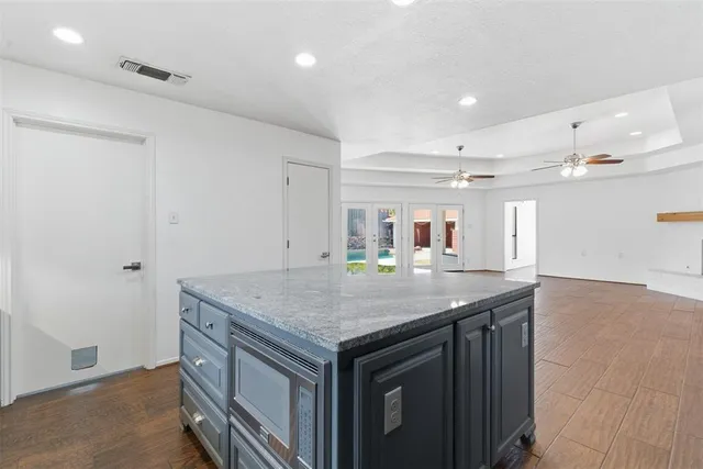 a kitchen with a stove a sink and a refrigerator