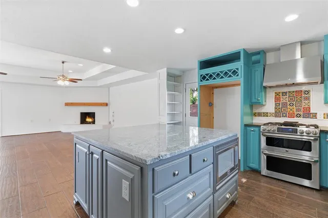 a kitchen with a stove and a sink