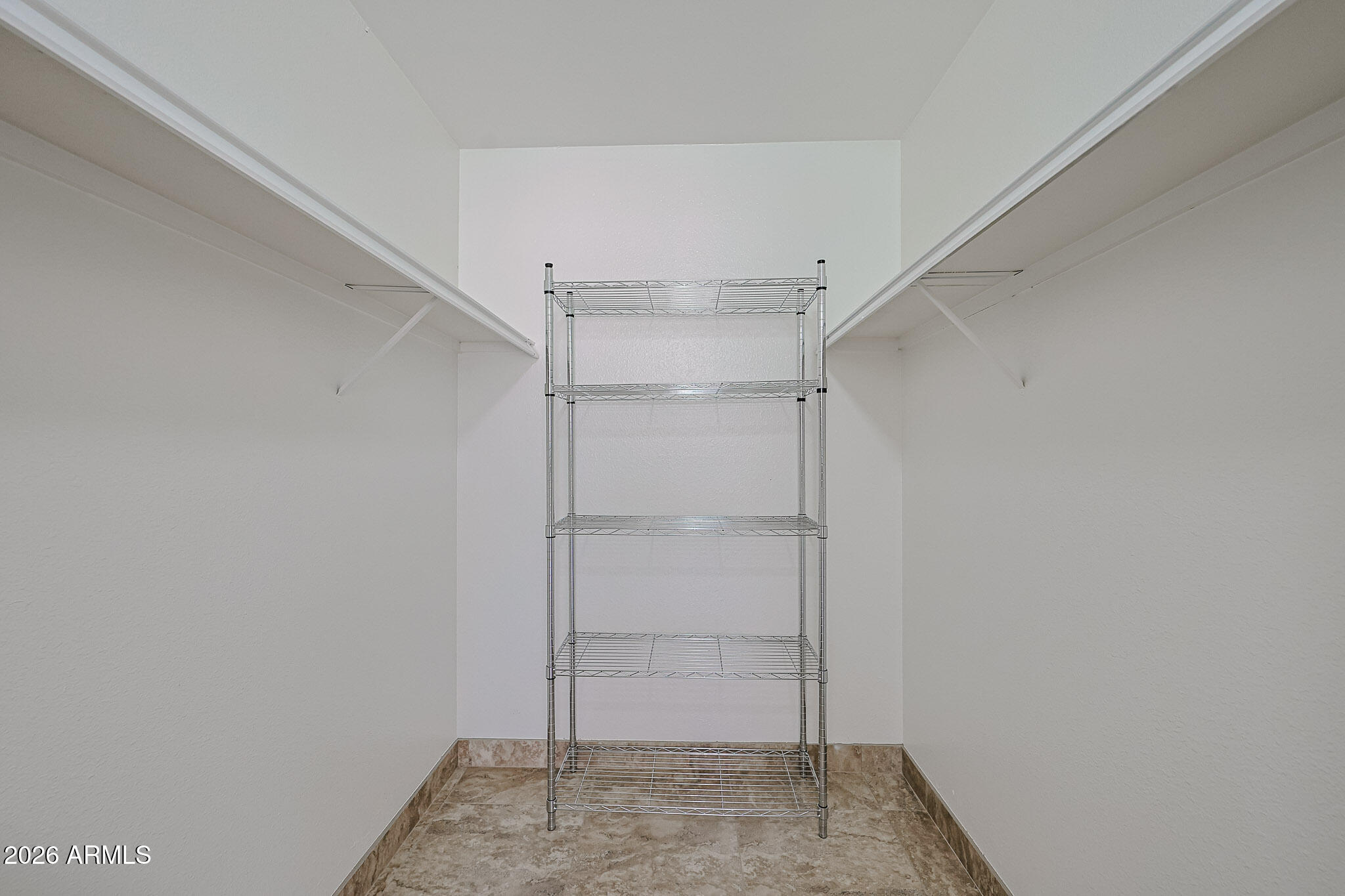 7920 East Camelback Road, Unit 111 Scottsdale, AZ 85251 - Photo 15 of 32 a view of an empty walk in closet