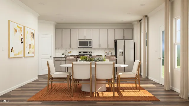 a dining room with furniture and wooden floor