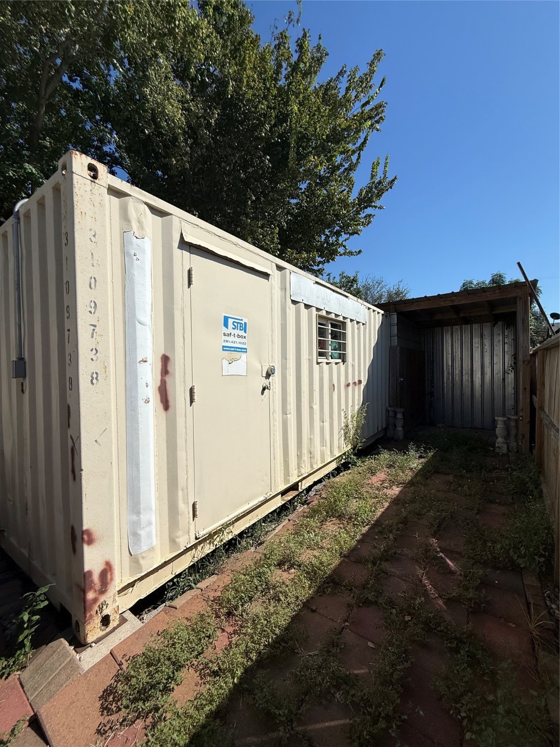 9838 Fillmore Street Houston, TX 77029 - Photo 3 of 9 a view of a house with backyard and wooden fence