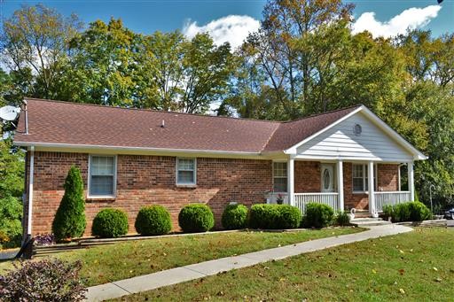 611 Blue Ridge Drive Columbia, TN 38401 - Photo 1 of 1 a front view of a house with a yard and potted plants