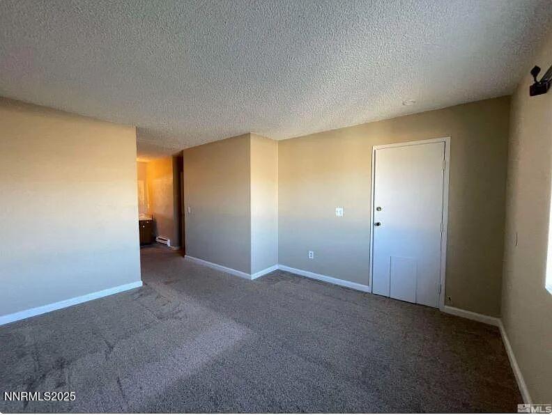 2375 Tripp Drive, Unit 9 Reno, NV 89512 - Photo 4 of 10 an empty room with windows