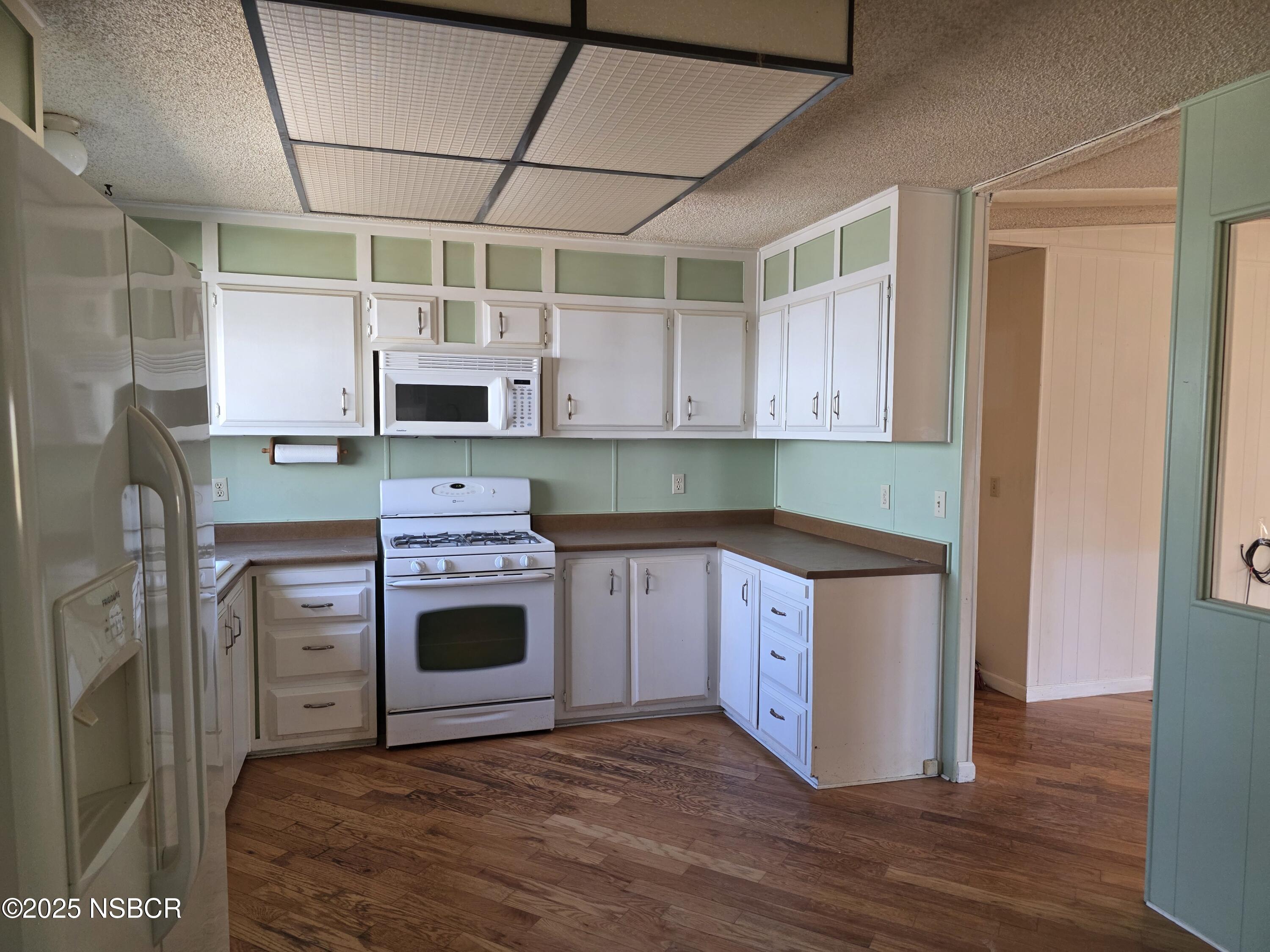 3822 Cherry Hill Road Santa Maria, CA 93455 - Photo 14 of 22 a kitchen with stainless steel appliances granite countertop a stove and a refrigerator