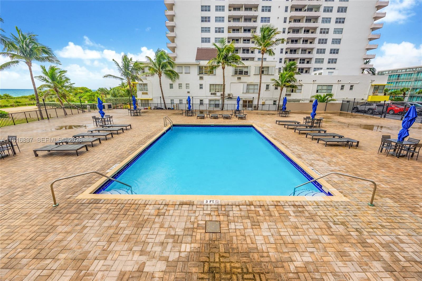 9273 Collins Avenue, Unit 507 Surfside, FL 33154 - Photo 15 of 22 swimming pool with outdoor seating