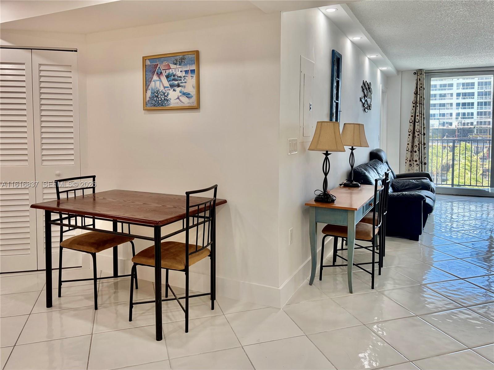 9273 Collins Avenue, Unit 507 Surfside, FL 33154 - Photo 7 of 22 a view of a livingroom with furniture and a window