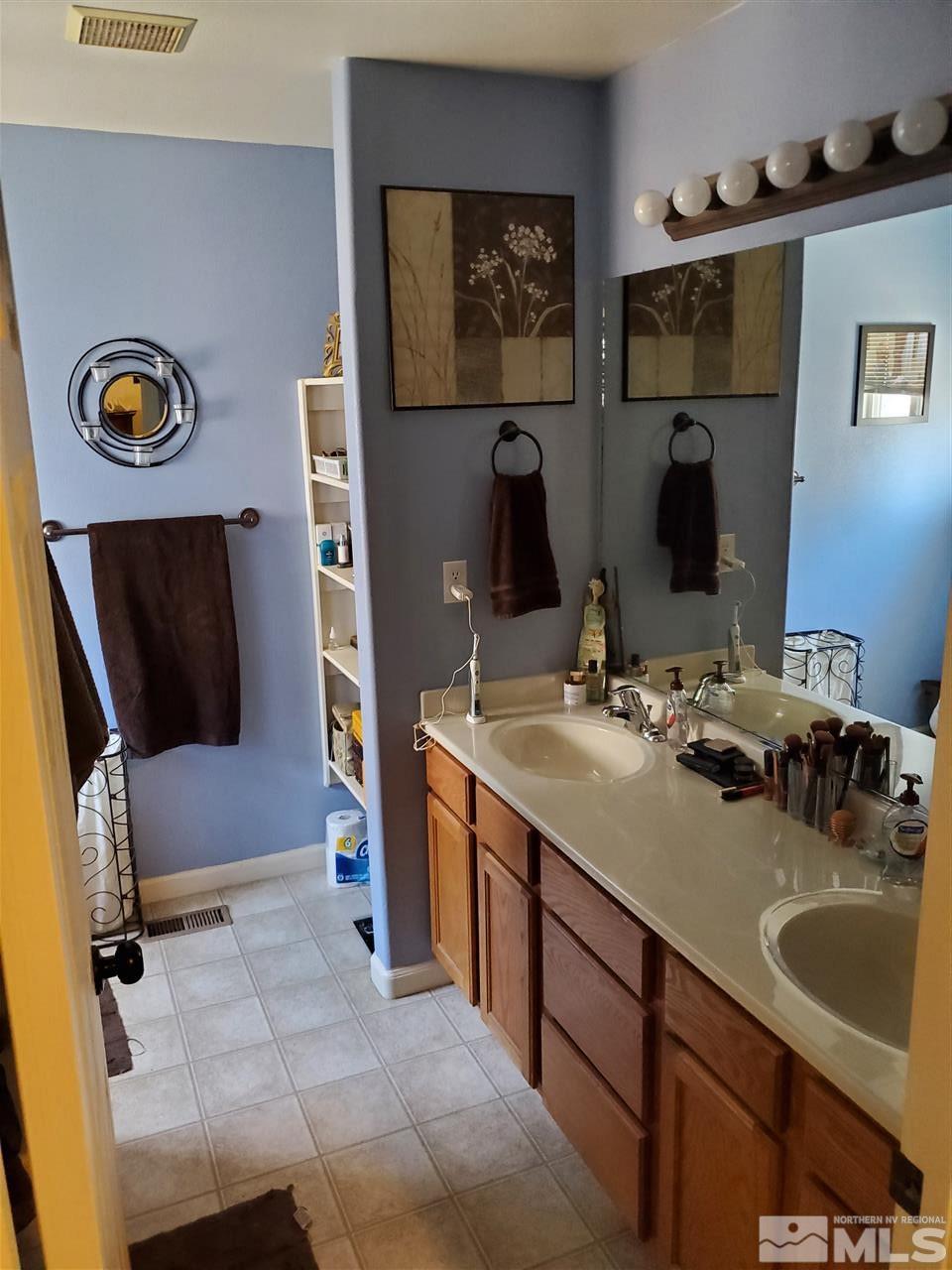 1239 Lattin Road Fallon, NV 89406 - Photo 12 of 15 a bathroom with a sink and a mirror