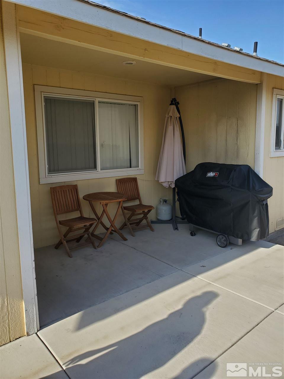 1239 Lattin Road Fallon, NV 89406 - Photo 14 of 15 a living room with furniture and a air conditioner vent
