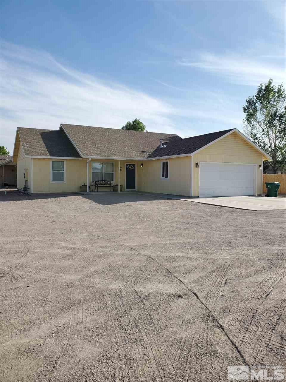 1239 Lattin Road Fallon, NV 89406 - Photo 2 of 15 a front view of a house with a yard
