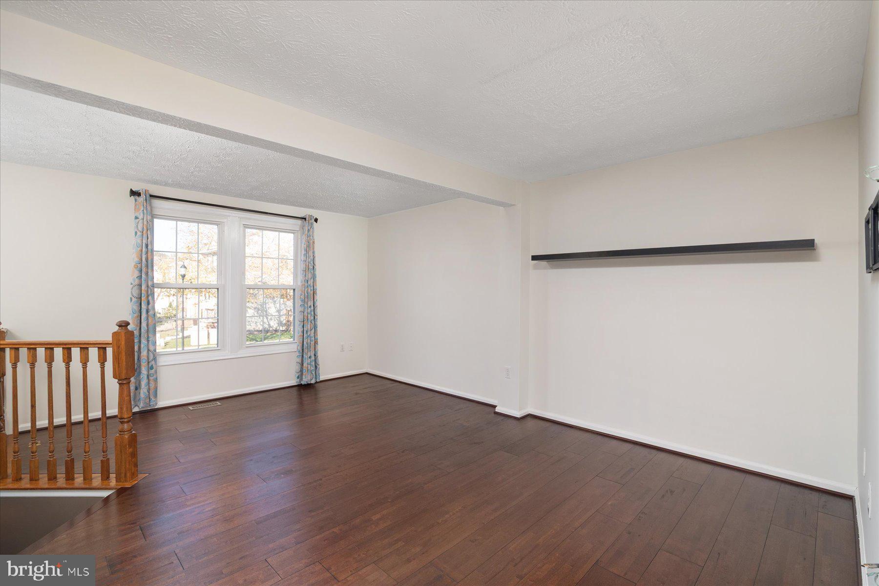 727 Dayspring Drive Odenton, MD 21113 - Photo 12 of 44 an empty room with wooden floor and windows