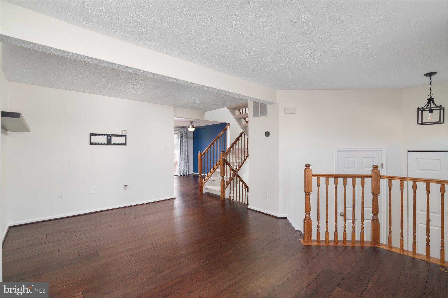 727 Dayspring Drive Odenton, MD 21113 - Photo 13 of 44 a view of an empty room with wooden floor