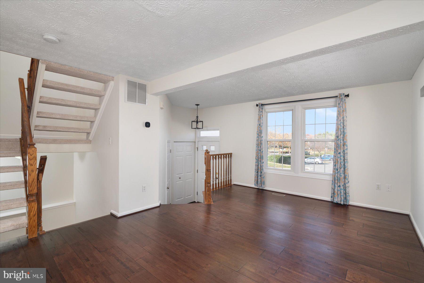 727 Dayspring Drive Odenton, MD 21113 - Photo 14 of 44 an empty room with wooden floor and windows