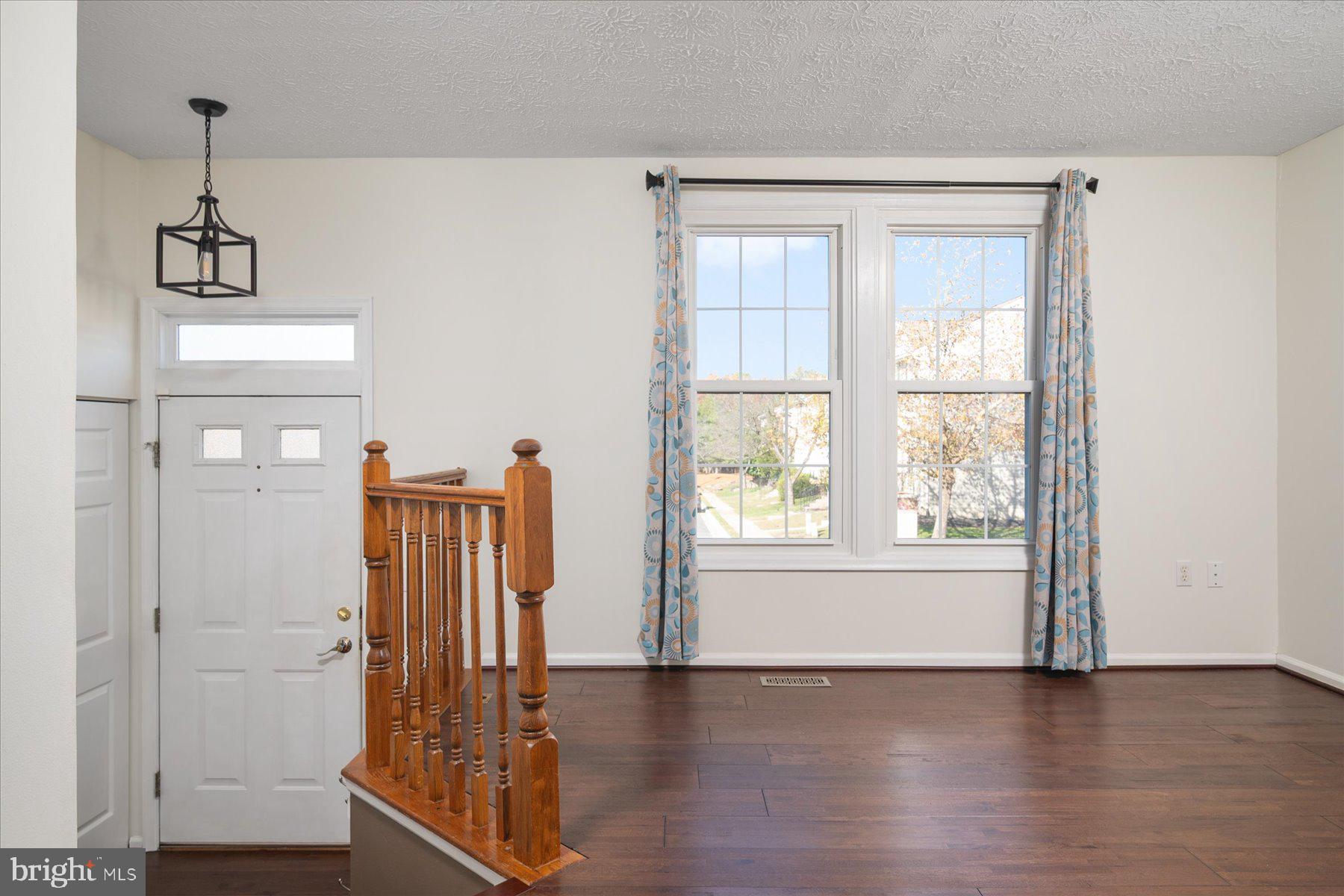 727 Dayspring Drive Odenton, MD 21113 - Photo 15 of 44 a view of empty room with wooden floor and fan