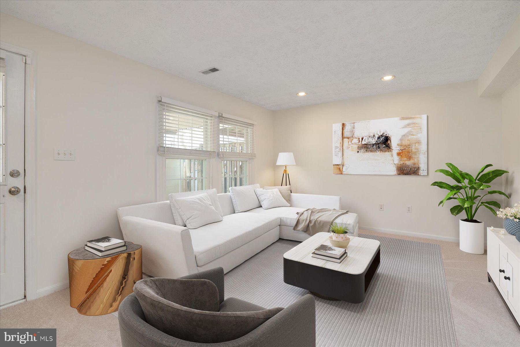 727 Dayspring Drive Odenton, MD 21113 - Photo 16 of 44 a living room with furniture and a potted plant
