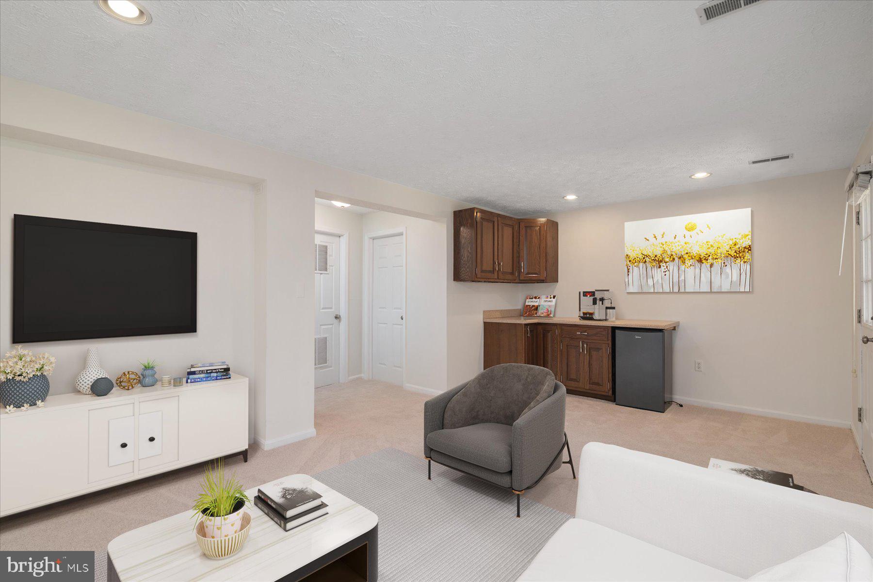 727 Dayspring Drive Odenton, MD 21113 - Photo 18 of 44 a living room with furniture and a flat screen tv