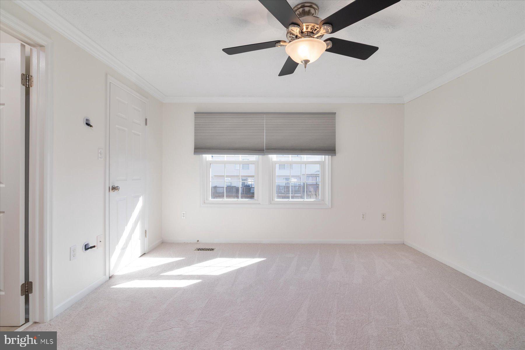 727 Dayspring Drive Odenton, MD 21113 - Photo 21 of 44 an empty room with a window and a fan