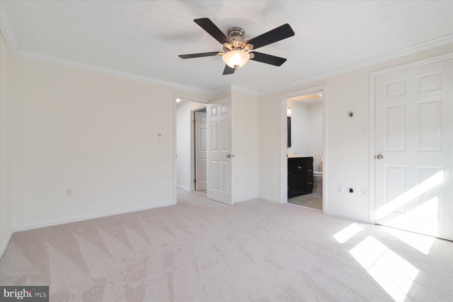 727 Dayspring Drive Odenton, MD 21113 - Photo 22 of 44 a view of an empty room with a ceiling fan
