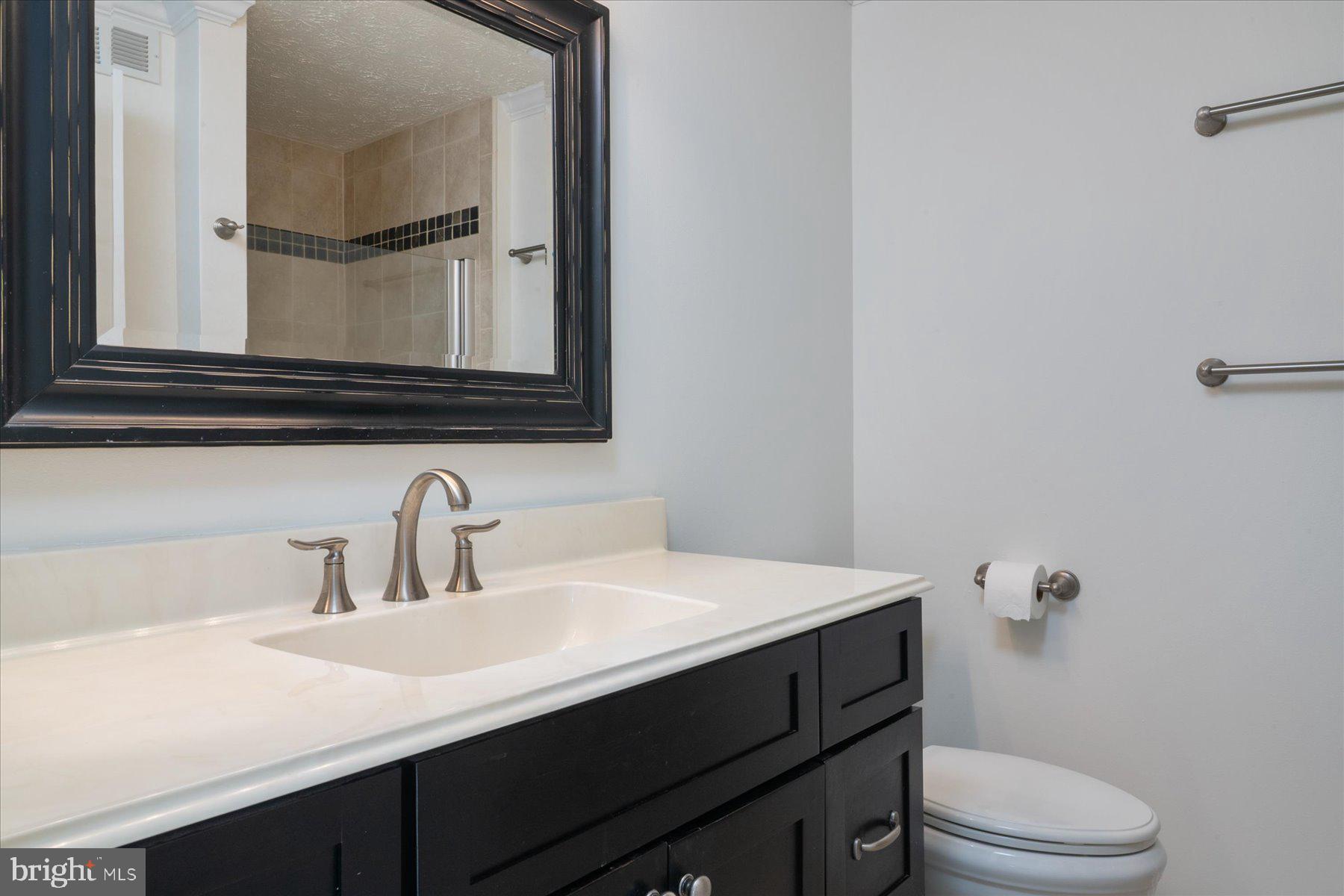 727 Dayspring Drive Odenton, MD 21113 - Photo 24 of 44 a bathroom with a sink a toilet and mirror
