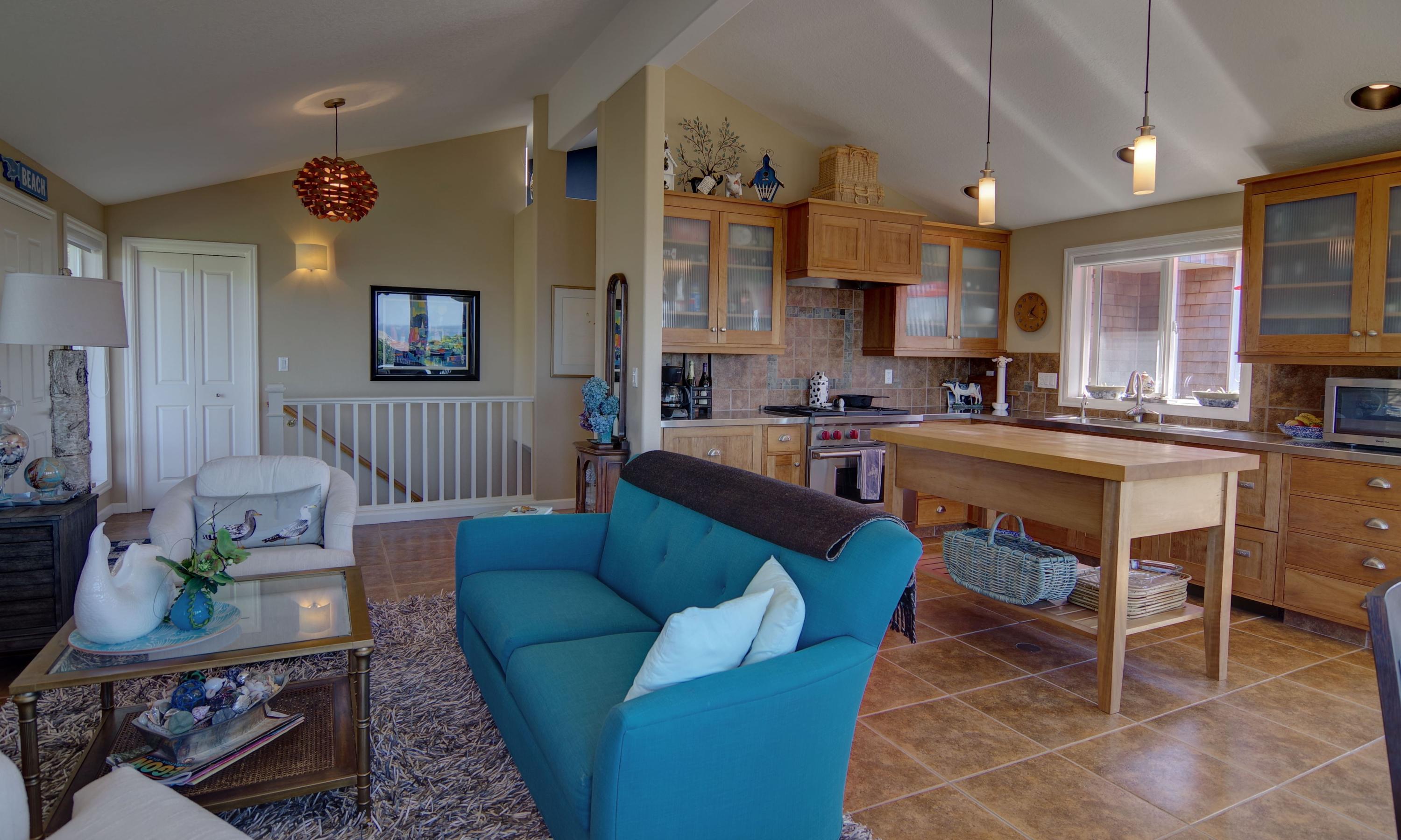 1065 Arthurs Road Oceanside, OR 97141 - Photo 14 of 47 a living room with furniture a fireplace and a flat screen tv