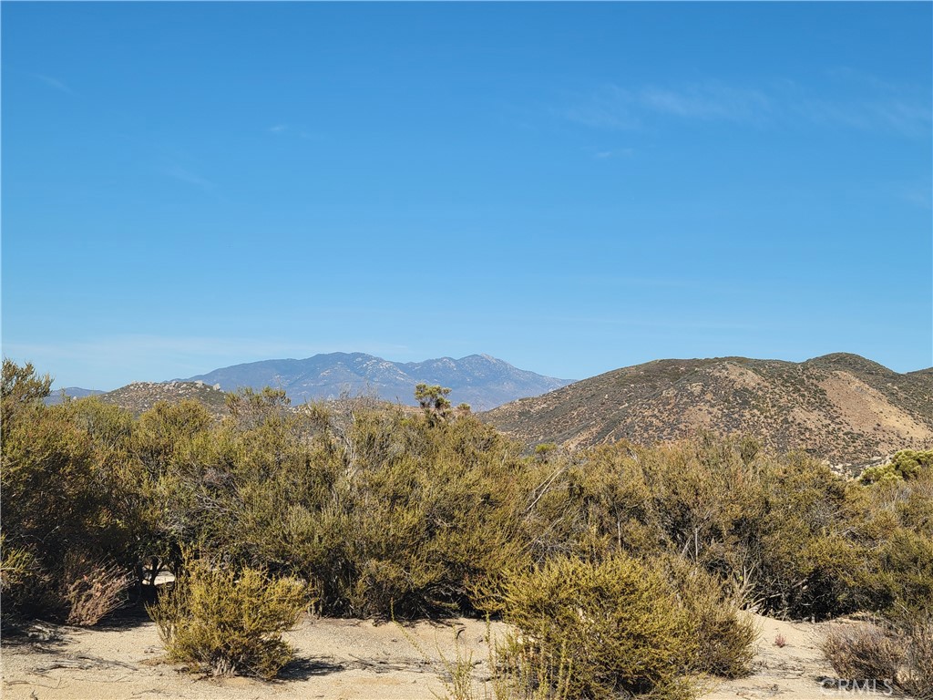 0 Tule Peak Road Aguanga, CA 92536 - Photo 15 of 18 a view of a mountain range in a cloudy sky