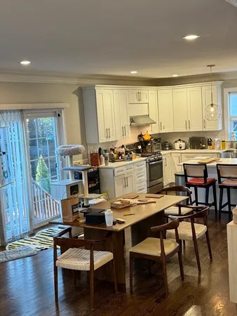a large kitchen with lots of counter space and stainless steel appliances