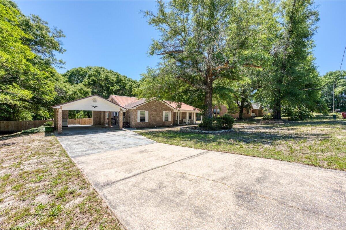 210 Shell Drive Crestview, FL 32536 - Photo 5 of 67 a front view of a house with a yard