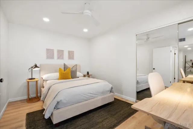 a bedroom with a bed and a couch