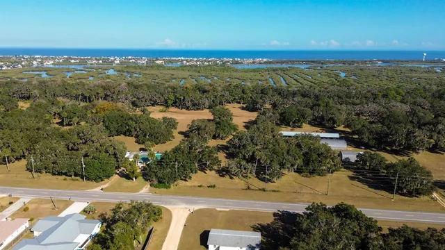 an aerial view of beach and city