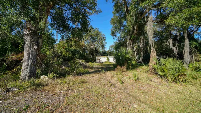 a backyard of a house with lots of green space