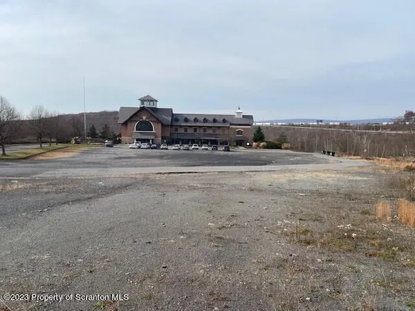 a view of a big yard with a road