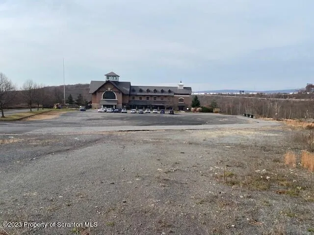 a view of a big yard with a road