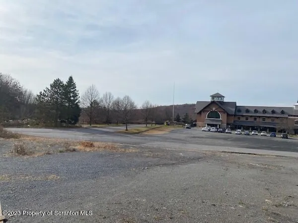 a view of a town with big trees