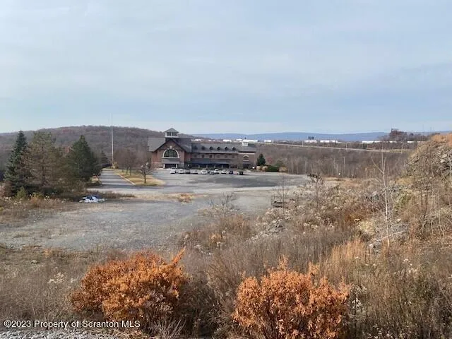 a view of a pathway with a field