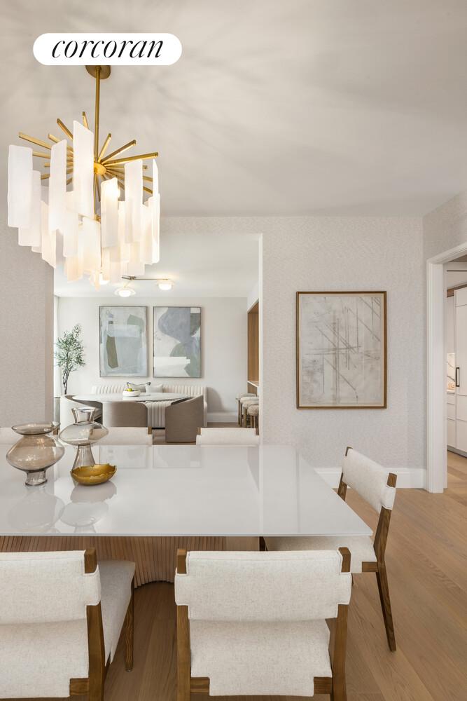 50 West 66th Street, Unit 8F Manhattan, NY 10023 - Photo 5 of 41 a view of a dining room with furniture and a chandelier