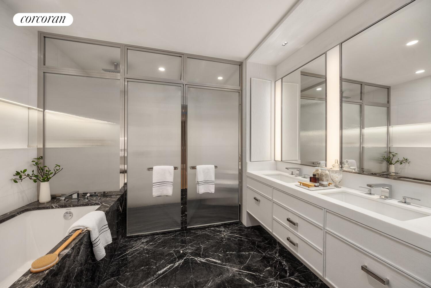 50 West 66th Street, Unit 8F Manhattan, NY 10023 - Photo 7 of 41 a bathroom with a double vanity sink and a bathtub