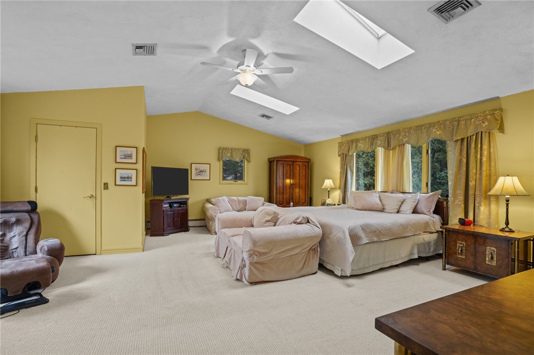 15 Jennifer Circle Cranston, RI 02921 - Photo 30 of 50 Primary bedroom suite with skylights and vaulted ceilings