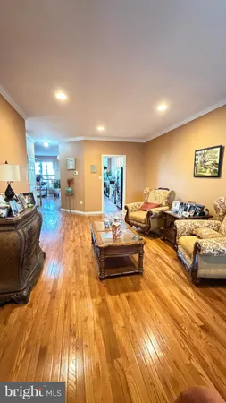 a kitchen with stainless steel appliances kitchen island granite countertop a stove a sink and a refrigerator