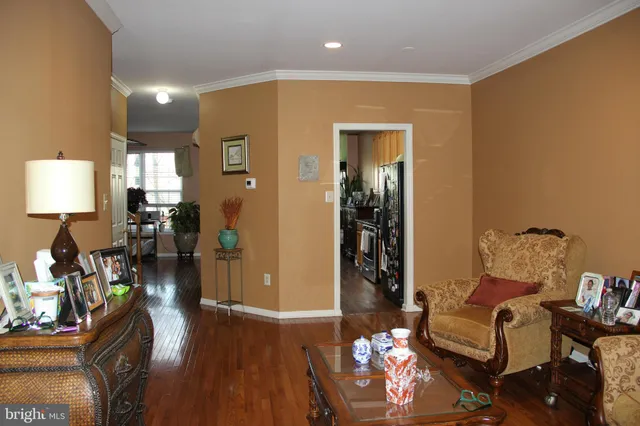 a kitchen with stainless steel appliances kitchen island granite countertop a stove a sink and a refrigerator