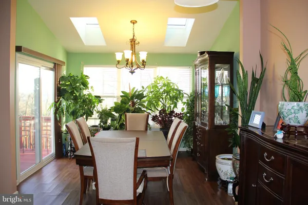 a view of room with furniture and wooden floor